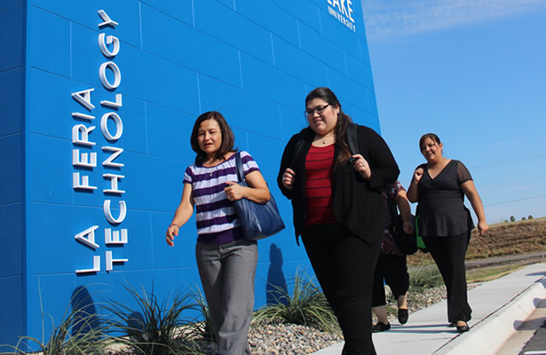 Group of females walking outside of La Feria Technology building