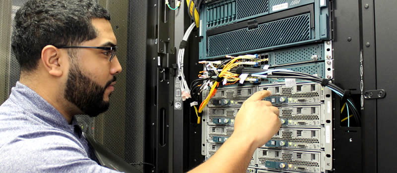 Male student working on network server
