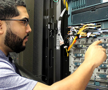 Male working on computer network server